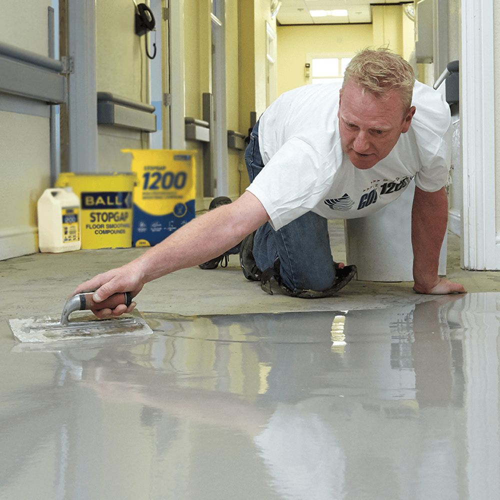 F-Ball Stopgap 1200 smoothing compound poured and spread on a subfloor