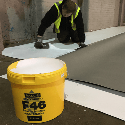 Sheet vinyl being laid over Styccobond F46 adhesive
