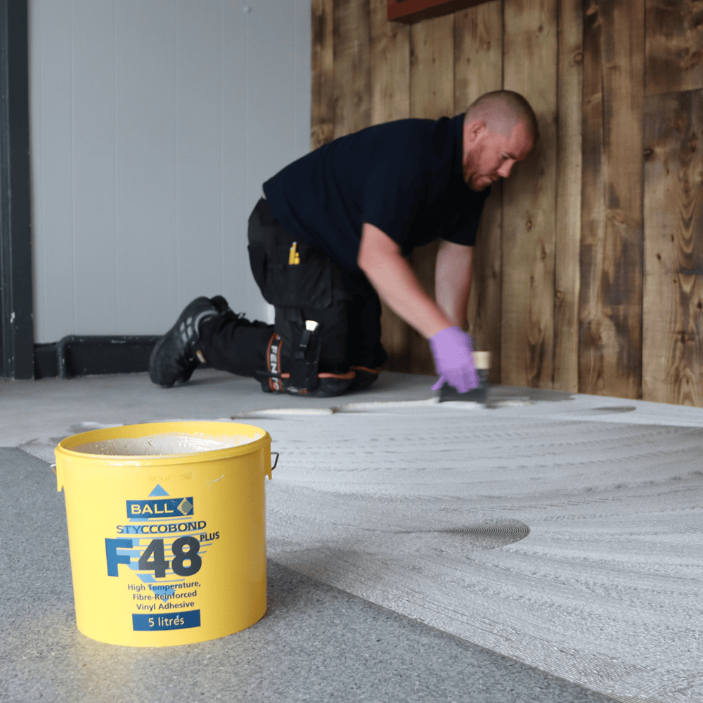 Styccobond F48 Plus adhesive in use fitting vinyl tiles