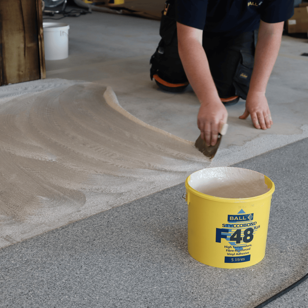 Styccobond F48 Plus being trowelled onto a subfloor