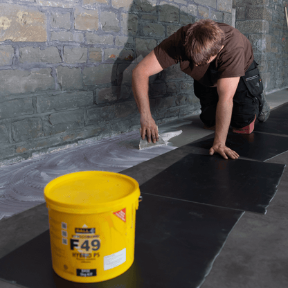 Rubber tiles being fitted with Styccobond F49 Hybrid PS adhesive