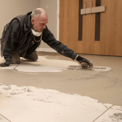 F-Ball Stopgap Fill and Prime being trowelled over floor panels