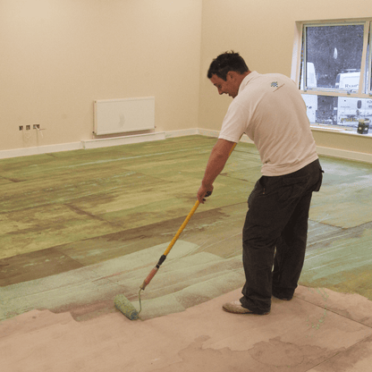 F-Ball Stopgap P131 green floor primer being applied with a roller