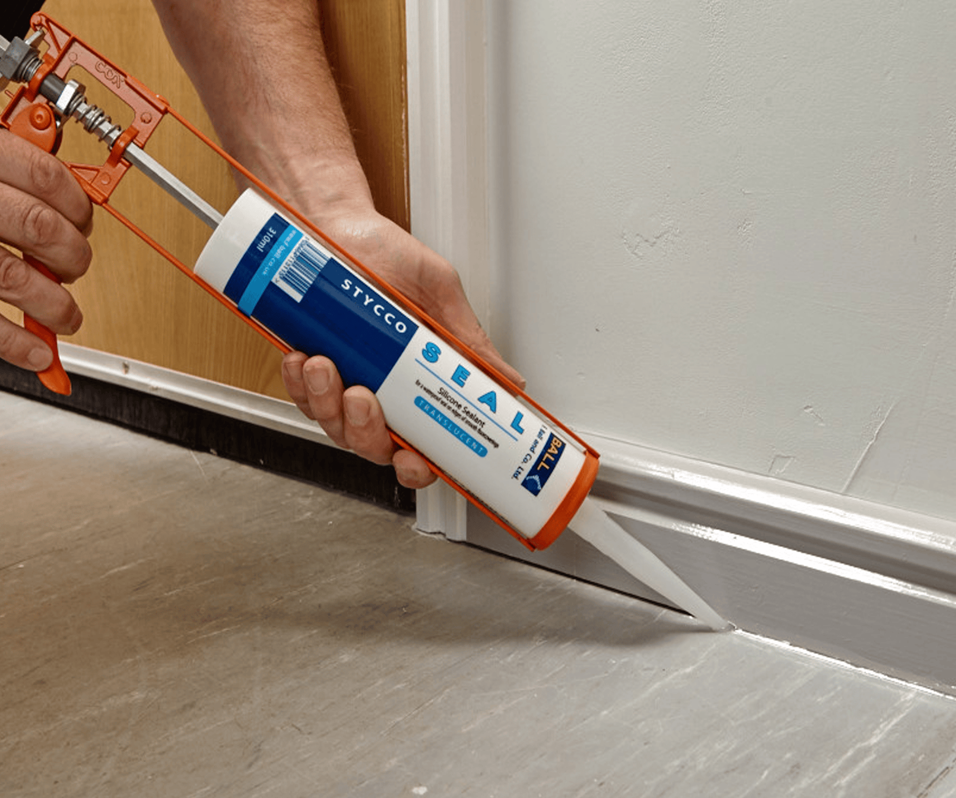 F-Ball Stycco Seal being applied along a white skirting board