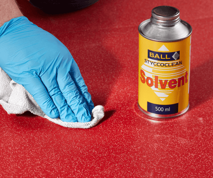 Styccoclean Solvent being used with a cloth to clean vinyl flooring