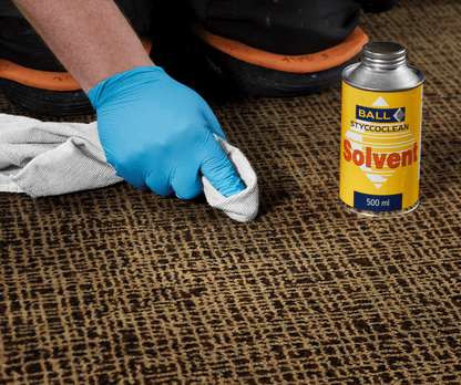 Styccoclean Solvent cleaning the back of a floorcovering before installation