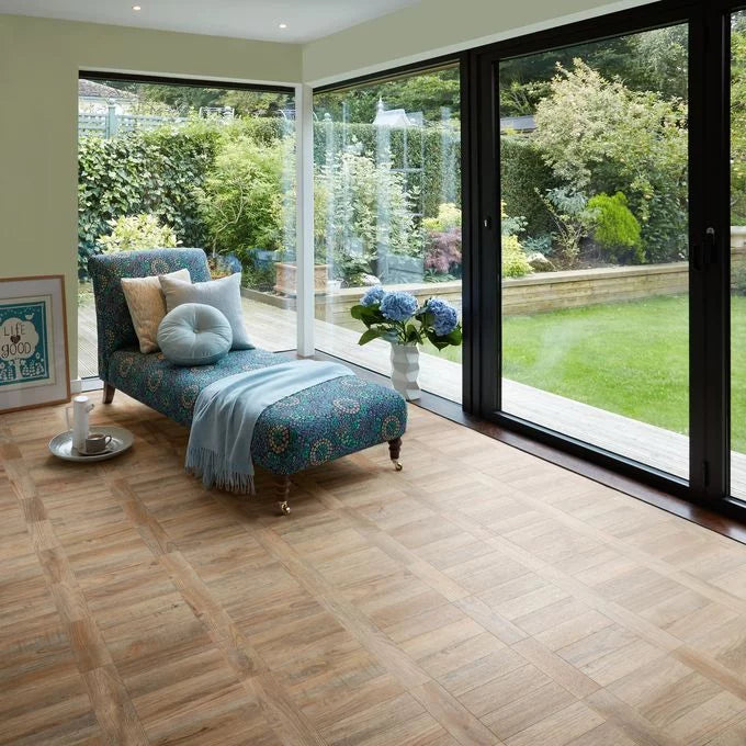 Polyflor Camaro PUR Cambridge Parquet LVT flooring installed in modern living room with natural wood effect